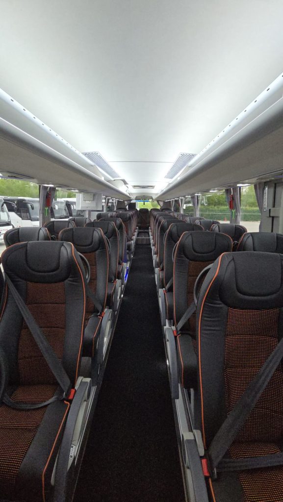 Inside a Nexus Coach Hire coach with leather reclining seats